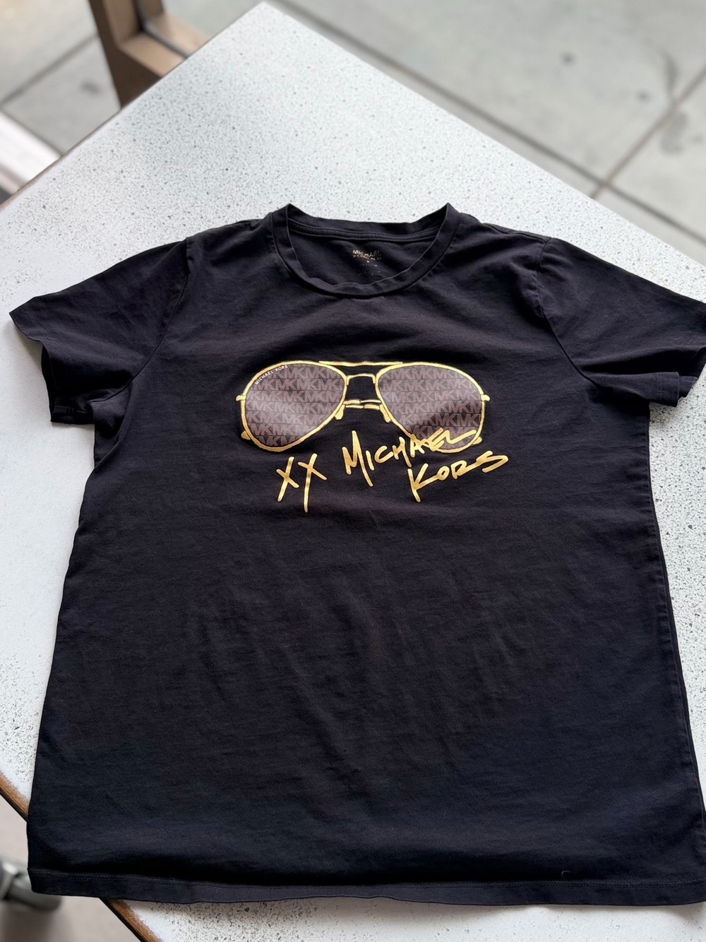 Michael Kors Black Graphic Tee with Gold Sunglasses